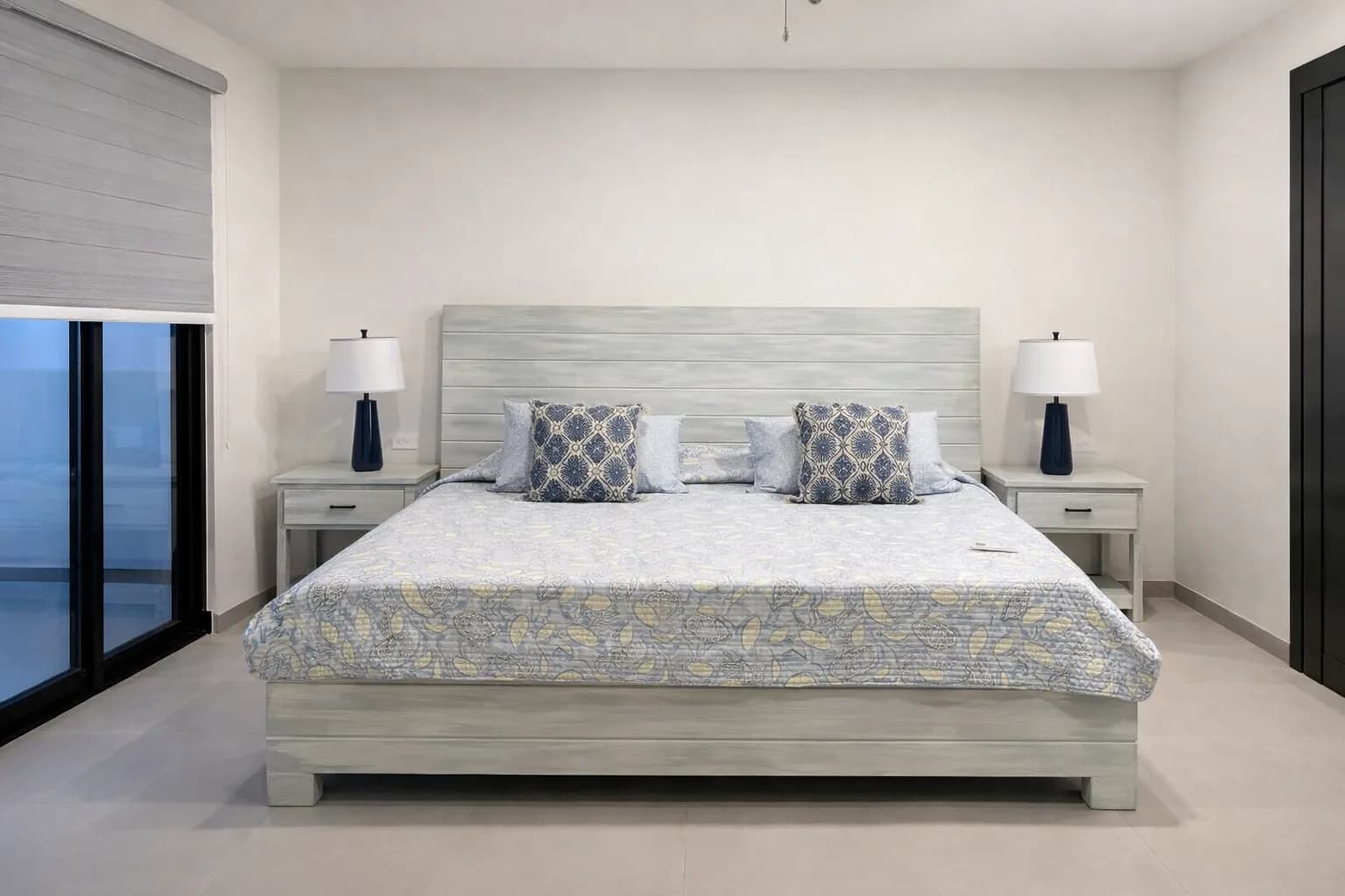 Light wood bed with upholstered bench and nightstands