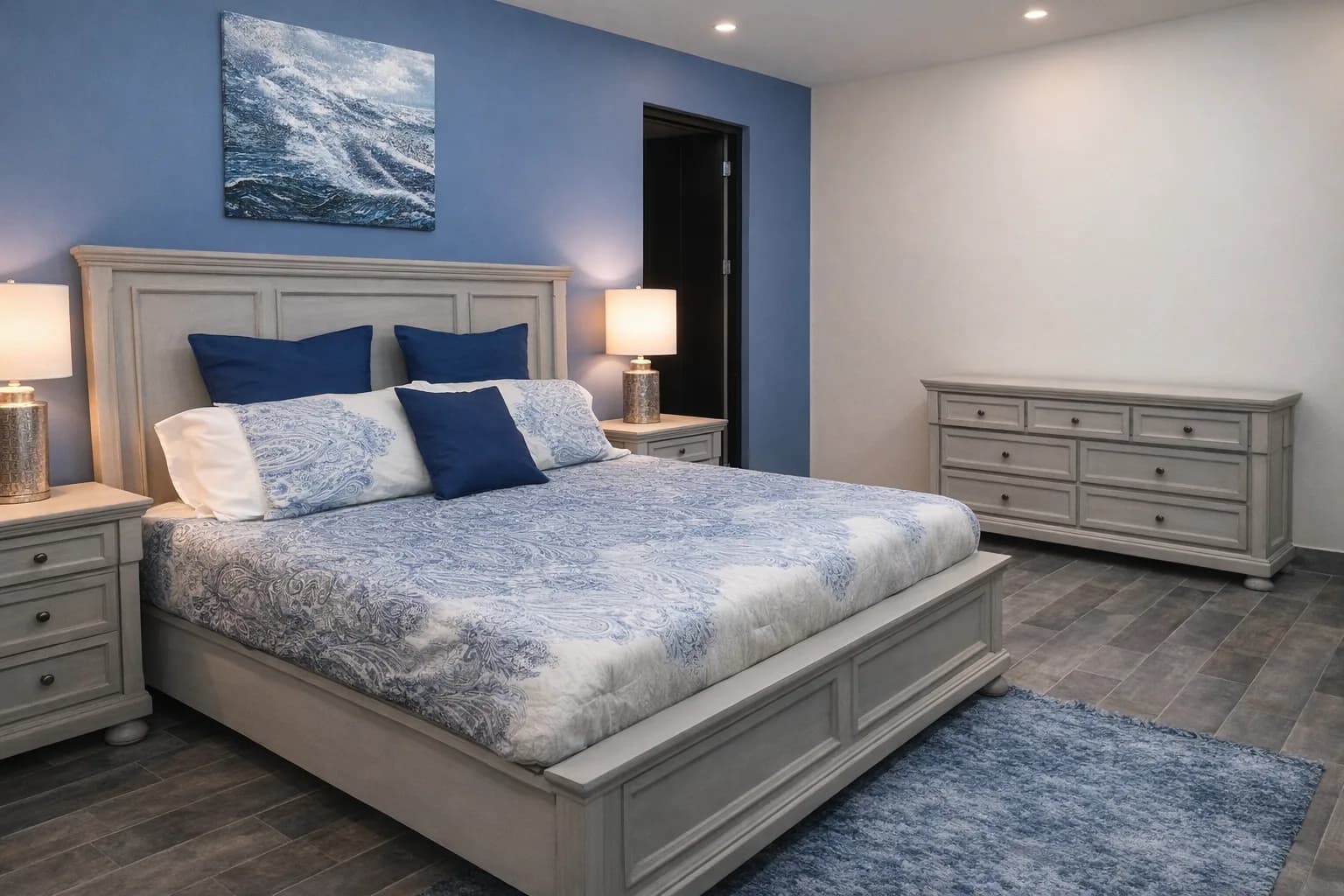 Bedroom suite with a carved wood bed and matching dresser
