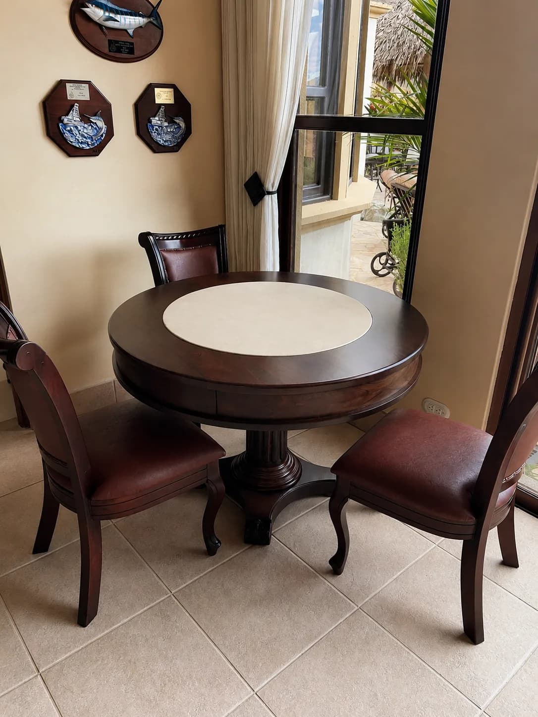 Round pedestal table with four wood chairs