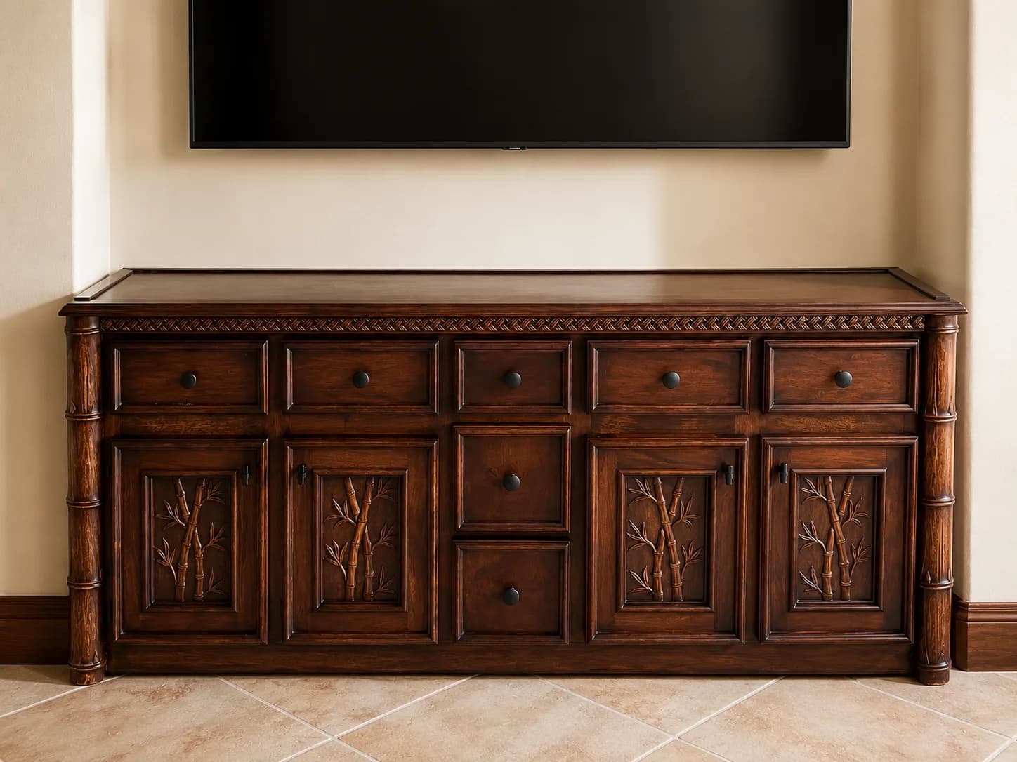 Traditional carved wood sideboard beneath a television
