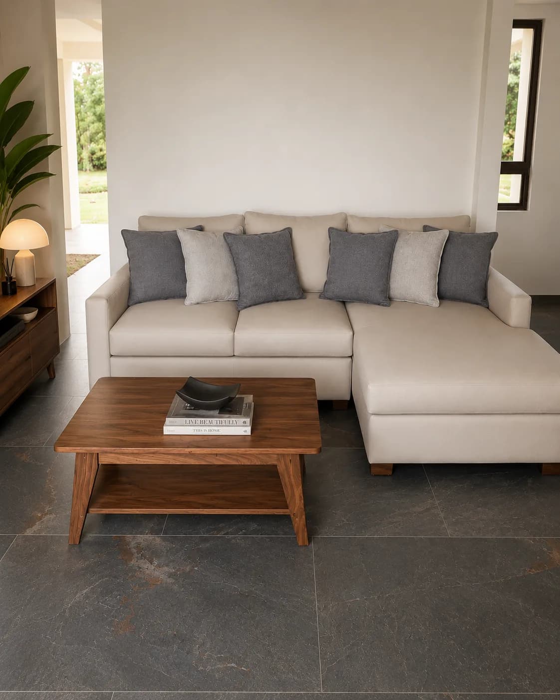 A refined Surí living space with a warm neutral sofa